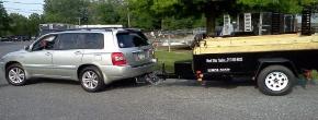 5' x 8' Dump Trailer being pulled by properly equiped Toyota Highlander
