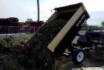 5' x 8' Dump Trailer Dumping Debris