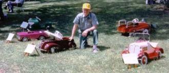 Richard showing pedal cars at a local car show.